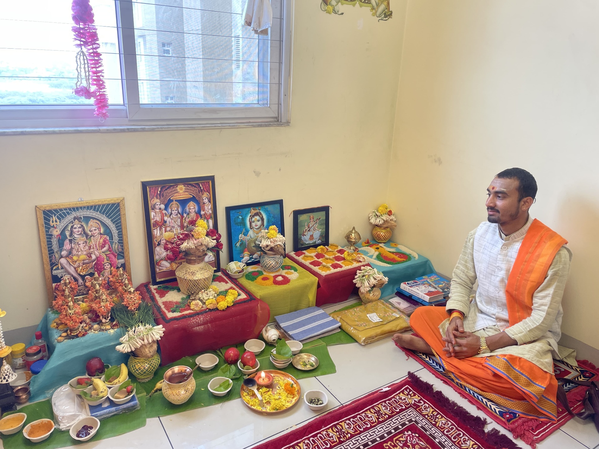 Pandit at traditional puja setup